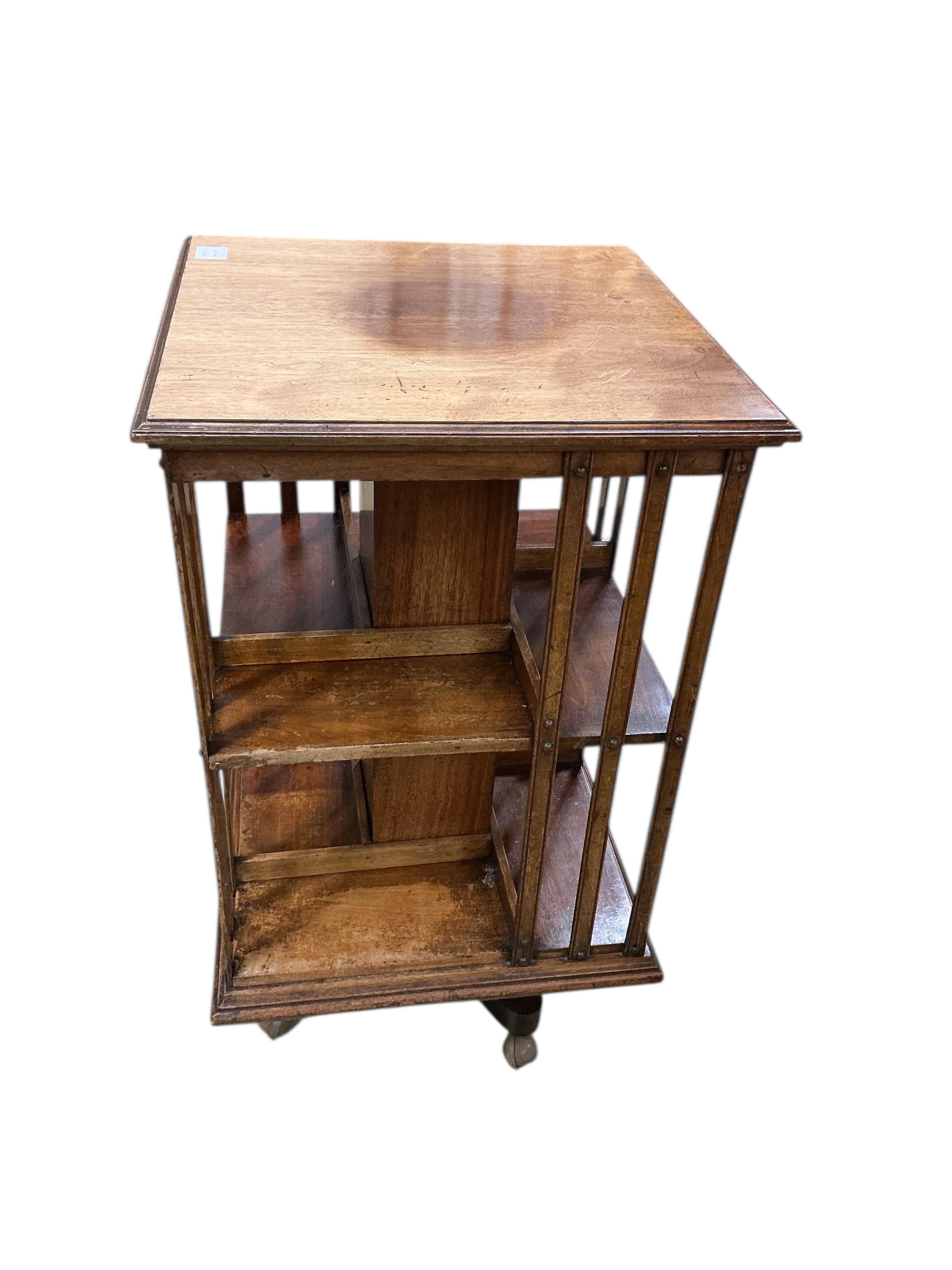 A late Victorian walnut revolving bookcase, width 52cm, depth 52cm, height 91cm